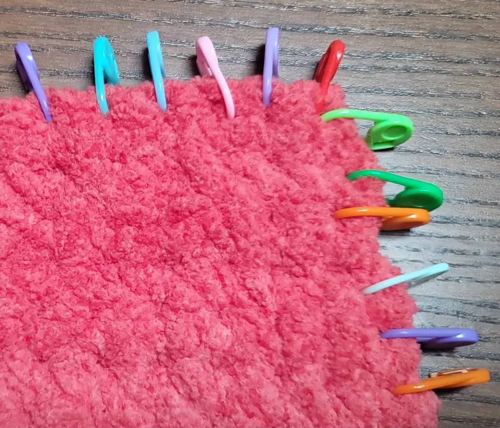 Perfect Phase Blanket in "Crimson" gauge showing 6 stitch markers wide and the same number tall.