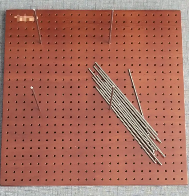 Picture of an empty blocking board with pins for crochet