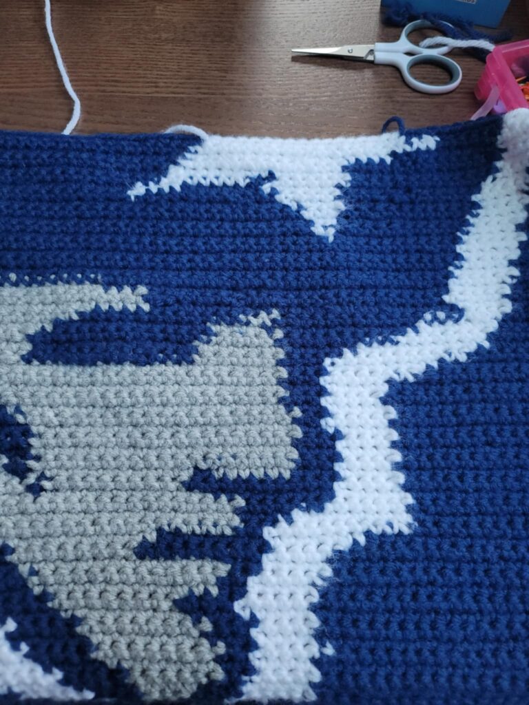 blue, white and gray face of the logo blanket pattern