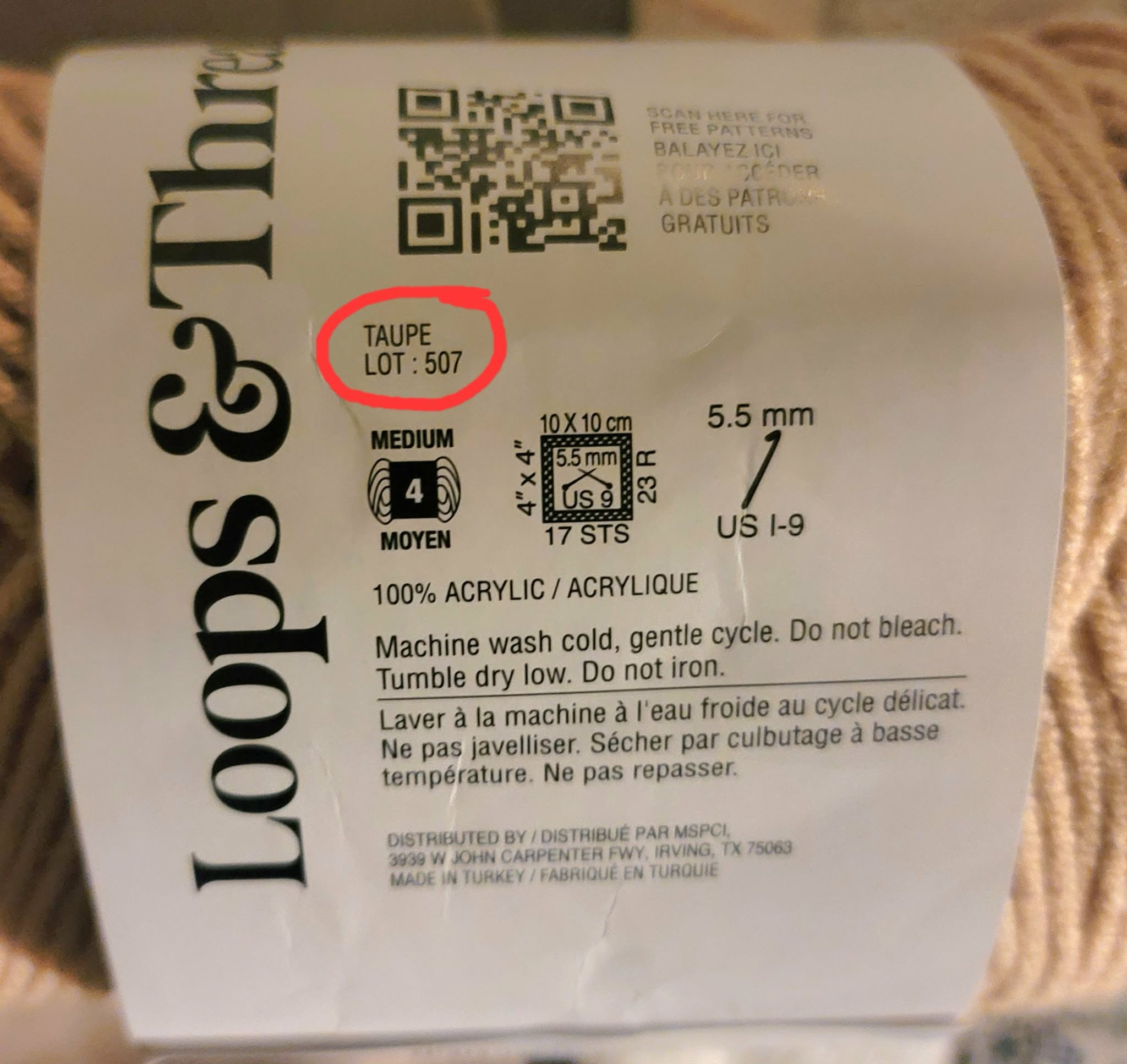 picture of a yarn label with the color name and dye lot number circled in red